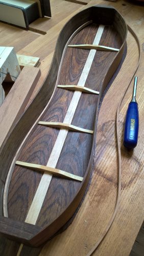 Back braced and glued to sides. Installing the cherry lining.